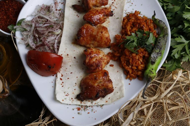barbecued chicken thighs and vegetables