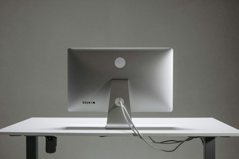 silver apple mac mini on white table
