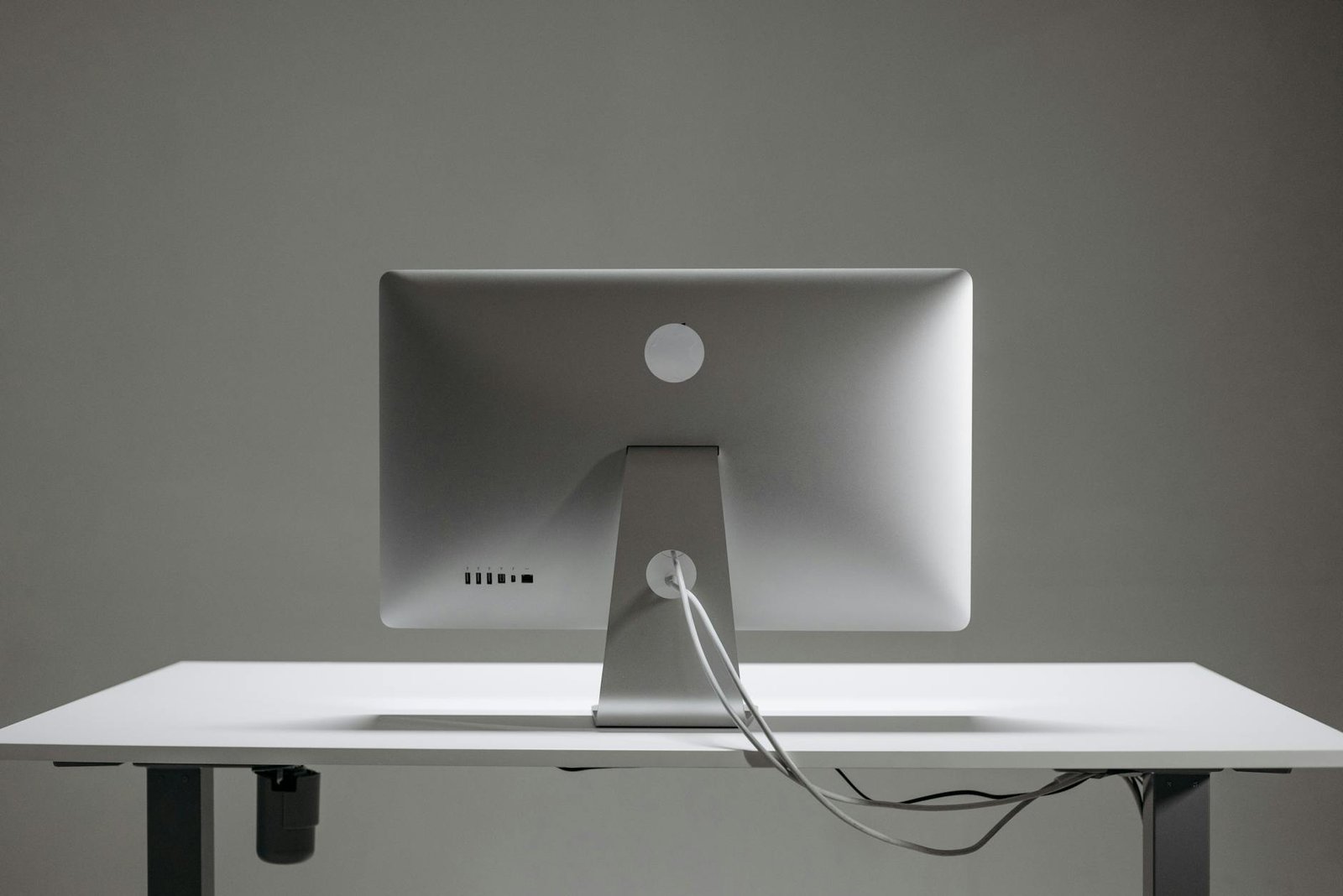 silver apple mac mini on white table