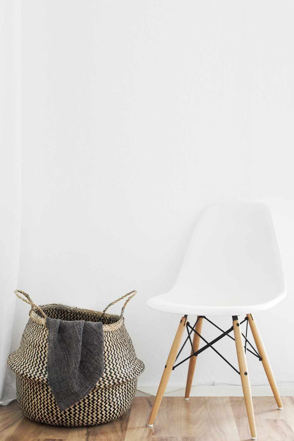 image of basket and small white chair by Sarah Dorweiler