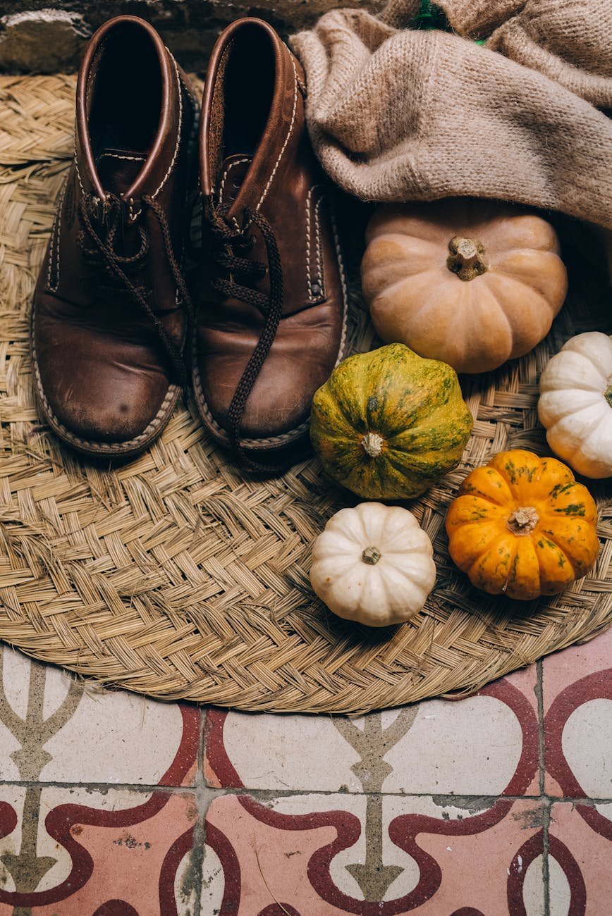 pumpkins beside the brown leather shoes